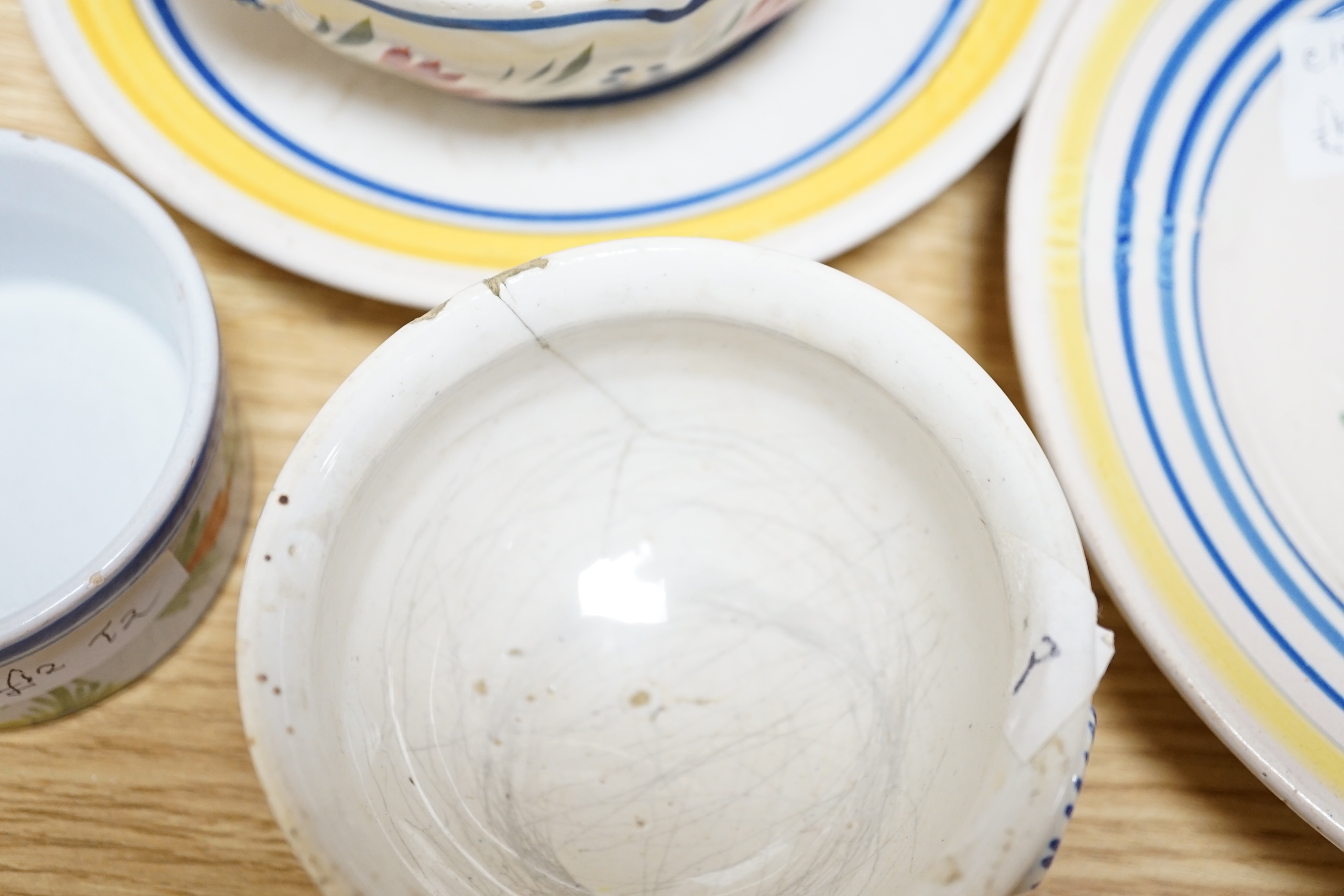 A group of Quimper pottery and a Quimper Pottery book by Angela Meadows
